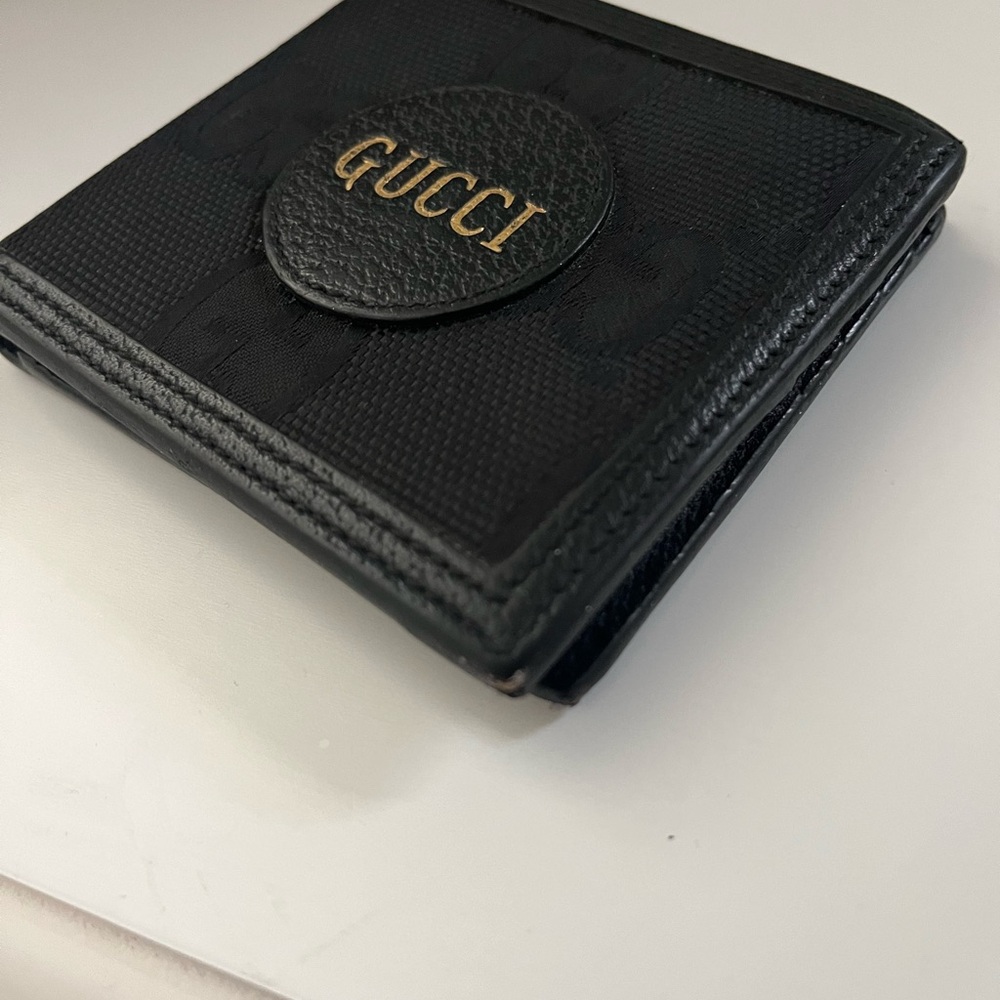 Gucci Black and Gold Bi-Fold Wallet